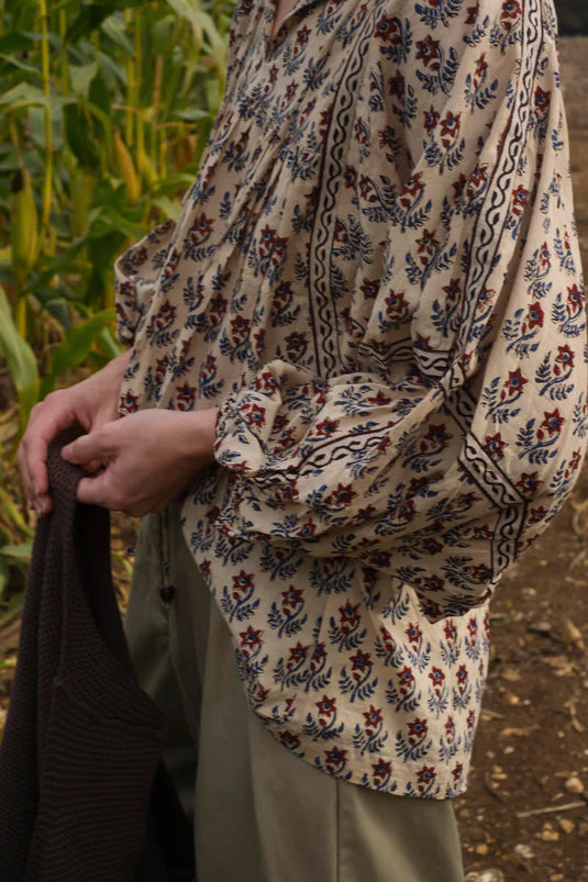 Boho floral block print top with gathered sleeves and artisan-crafted fabric.